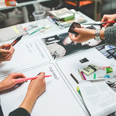 A group of newbie investors analysing the stock market before making an investment decision