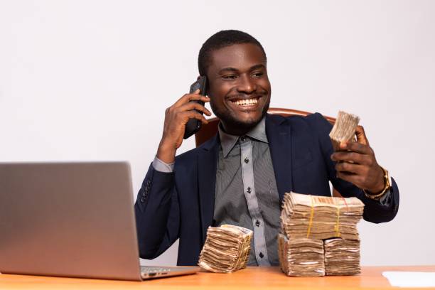 A man rejoicing after selecting the best dividend stock on the Nigerian stock market with trades trek stock simulator